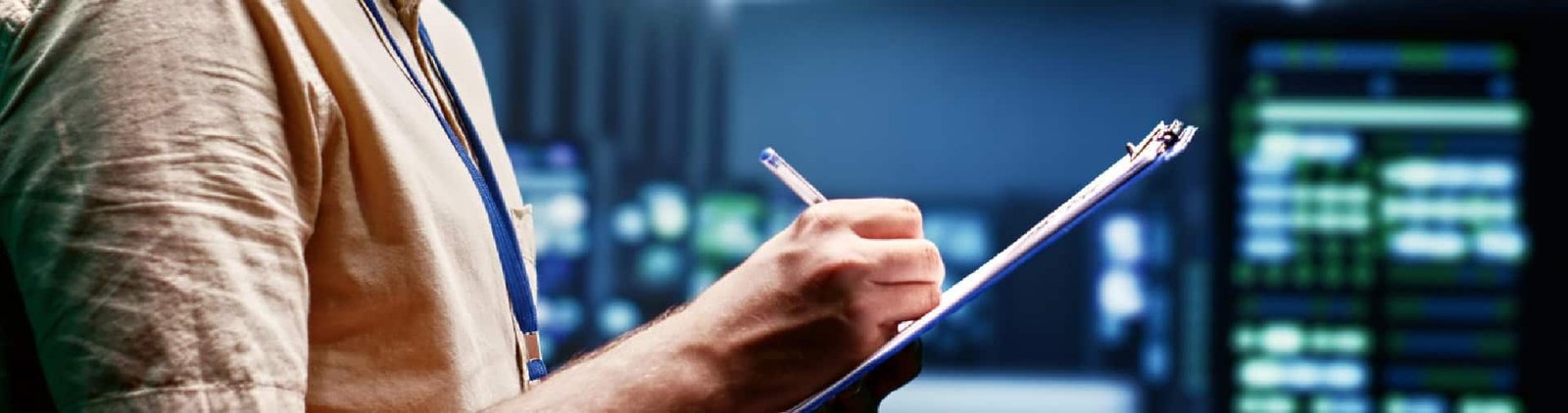 IT technician using a tablet while working in a server room